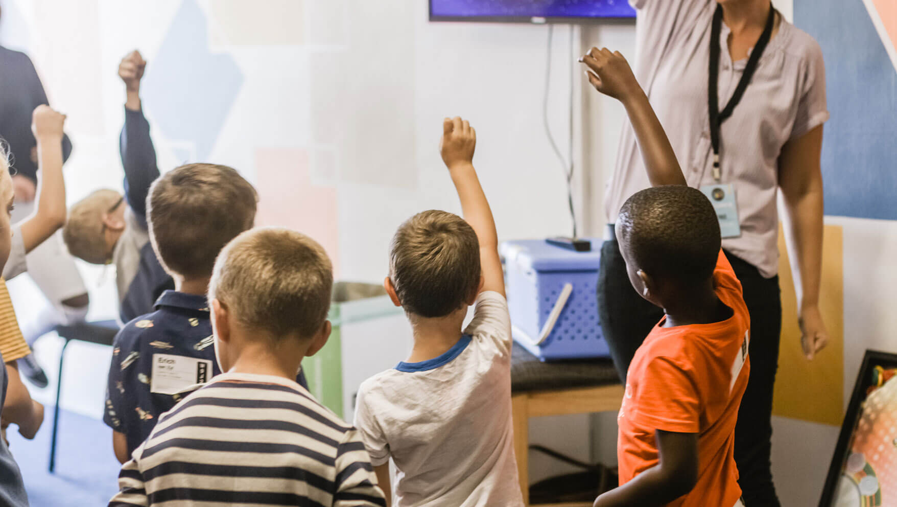 Children taking part in an interactive classroom lesson